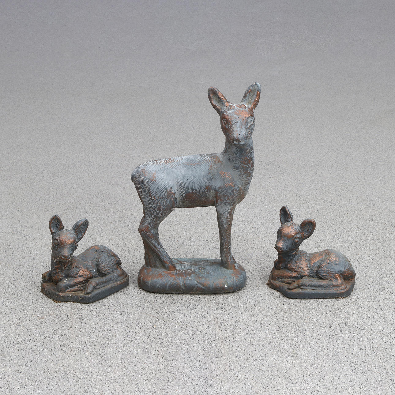 GARDEN SCULPTURES, THREE PCS. Painted casting mass. Deer animals. 20th century.