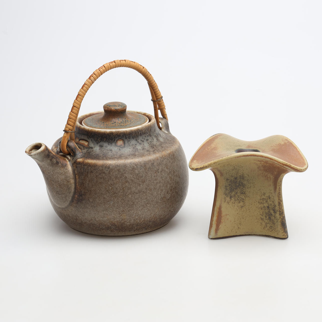 A ceramic jug and candlestick, Rörstrand.