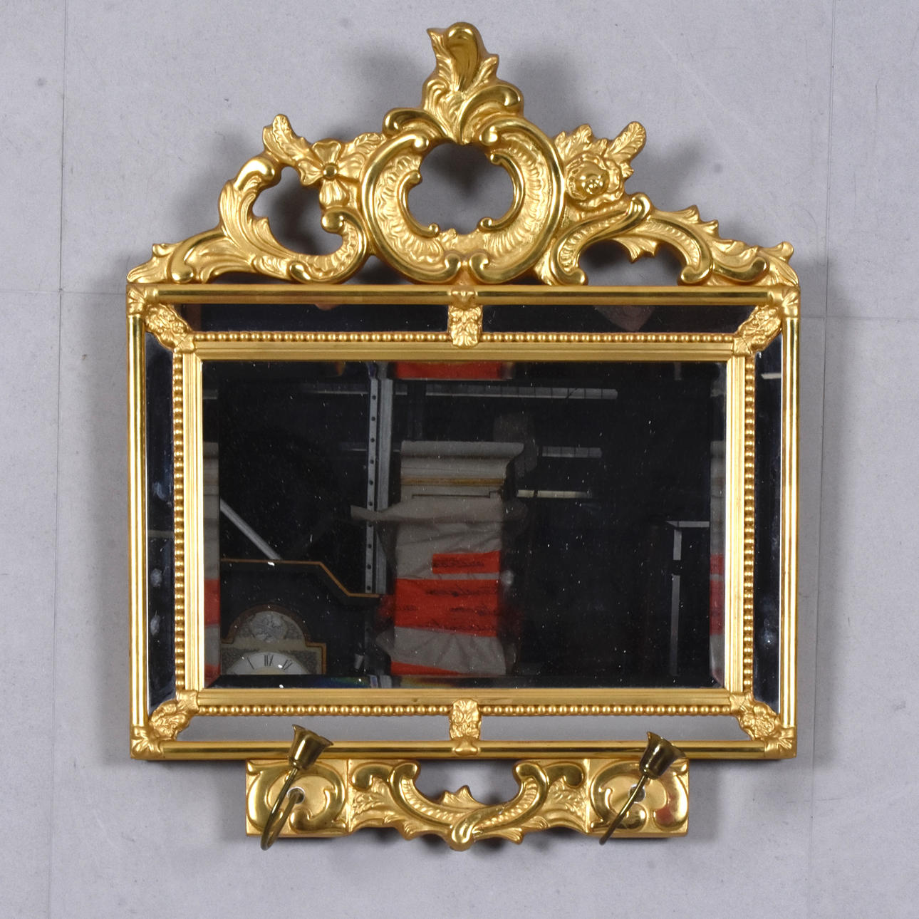 A wall mirror, gilt, 20th century.
