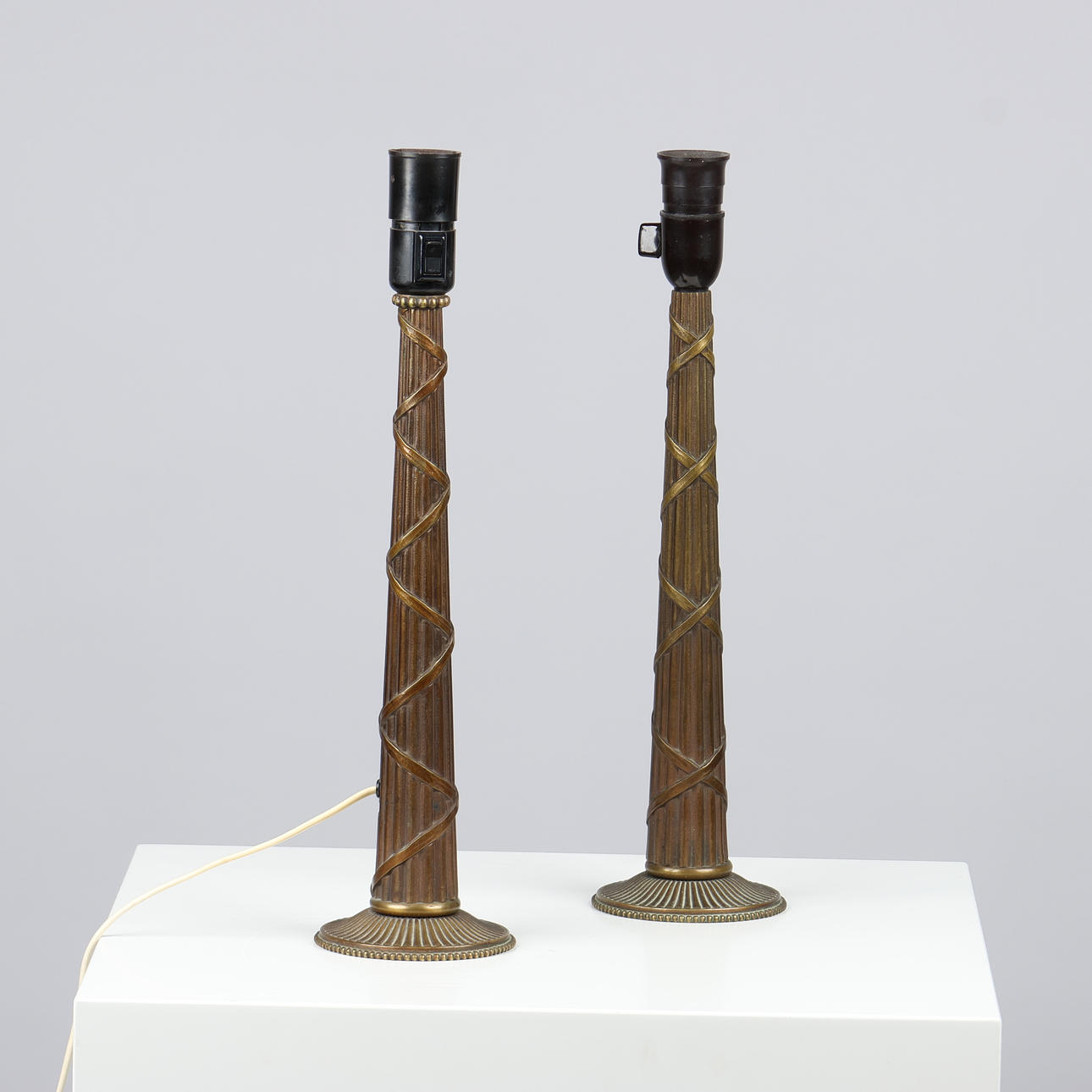 A pair of bronze table lamps in classicist style, 1920-30s (2).