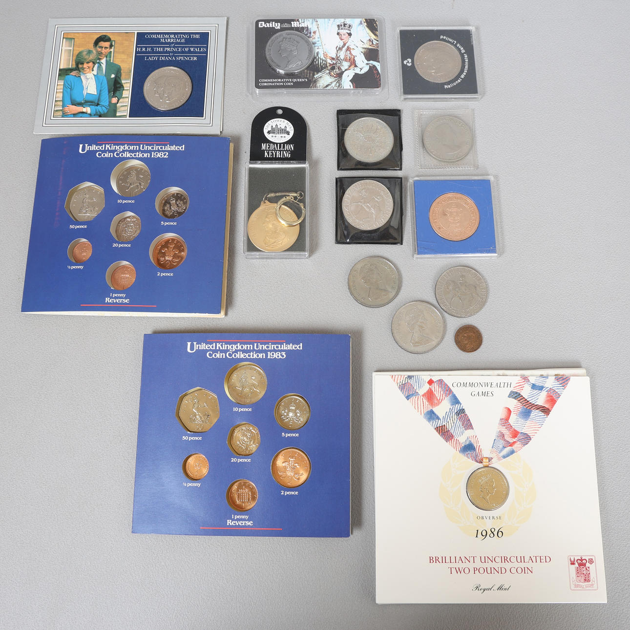 A COLLECTION OF COINS AND UNCIRCULATED SETS (QTY).