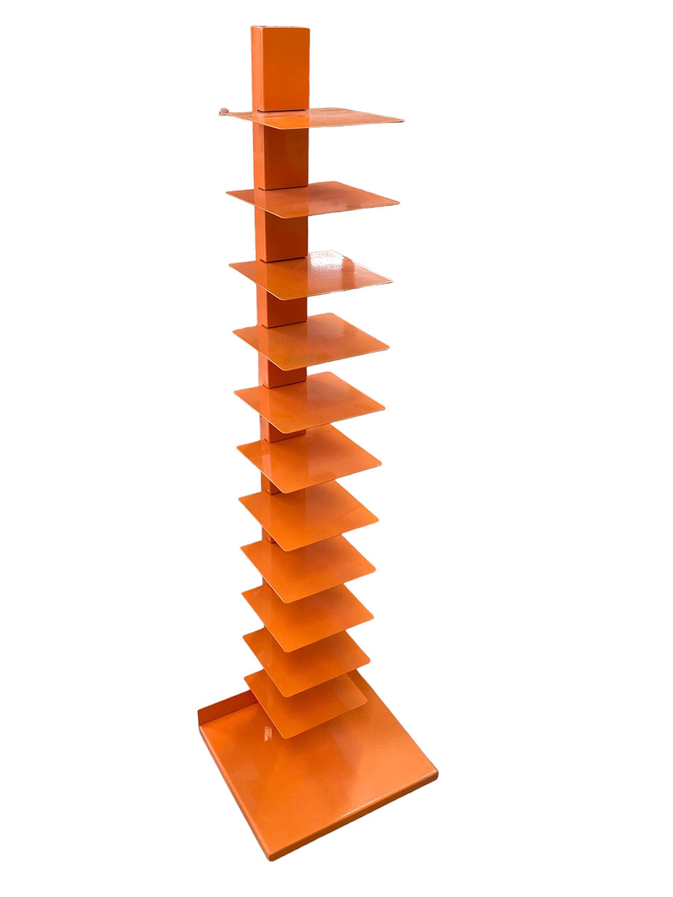 AN ORANGE CONTEMPORARY FLOOR STANDING METAL BOOKCASE.