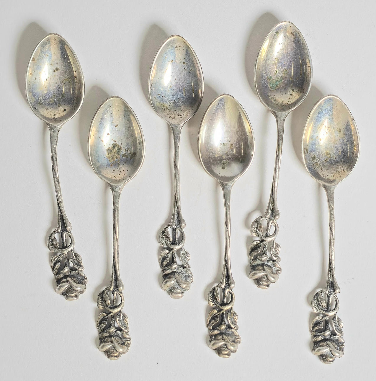 6 SILVER COFFEE SPOONS.