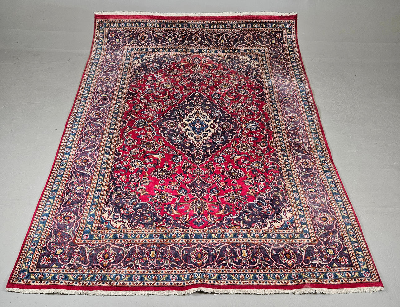 An oriental rug, approx. 283x203 cm.