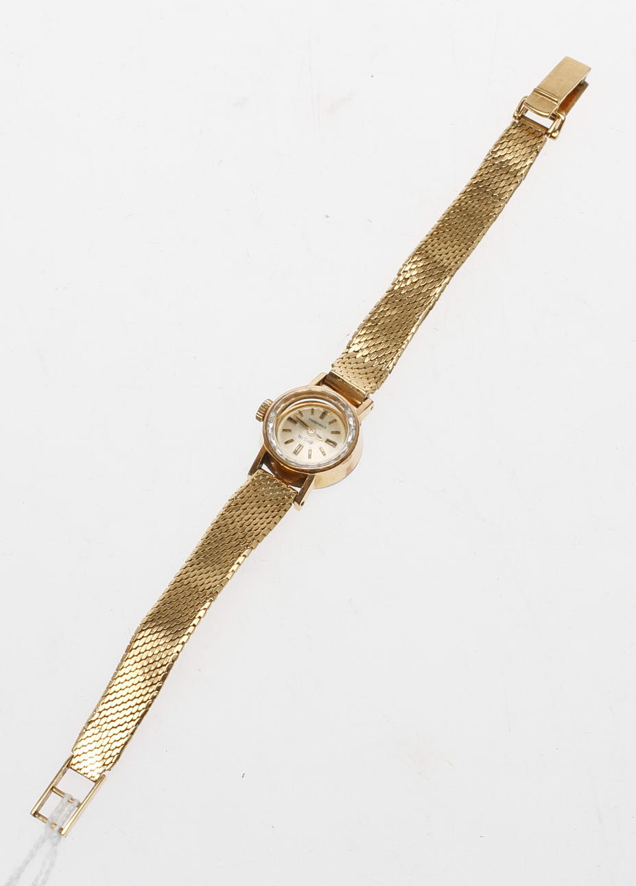 DAMARMBANDSUR med ARMBAND, 18k guld, vikt totalt ca 24,5 gram.