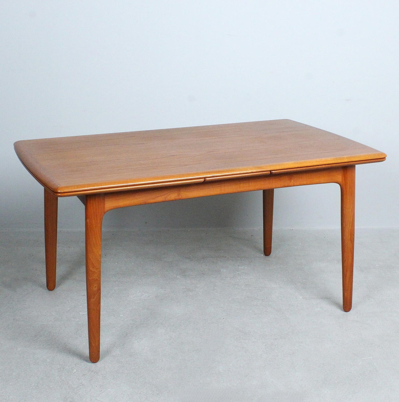 SVEND ÅGE MADSEN. Expandable teak dining table, Denmark, 1960s.