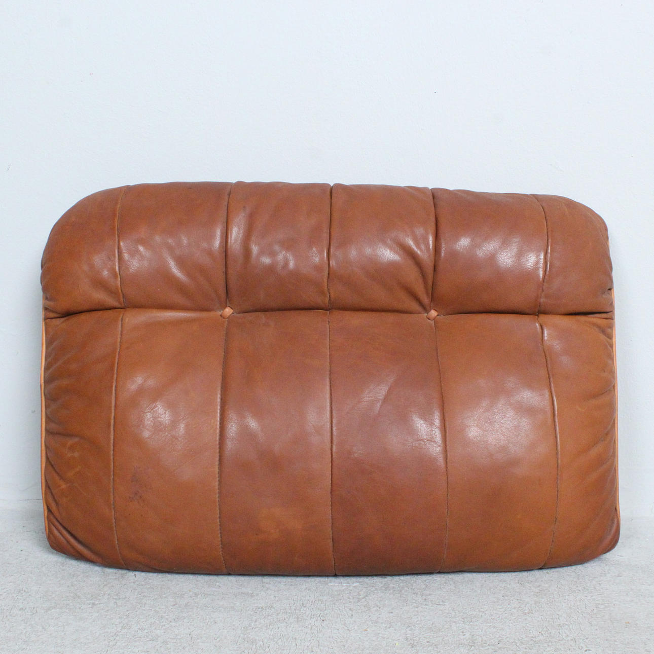 From Sede. cushion, patchwork leather, Switzerland, 1970s.