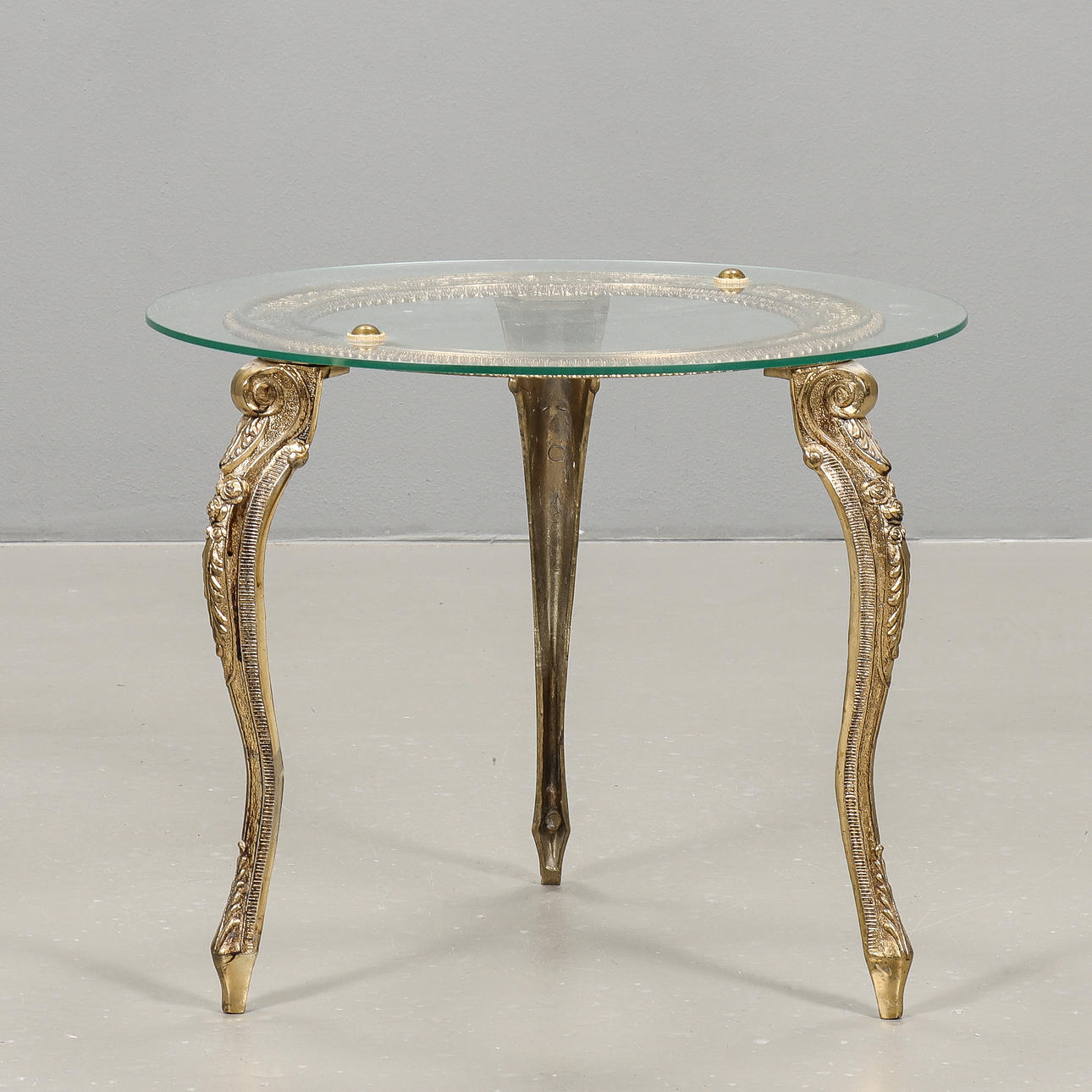 A Rococo style metal and glass relief table, second half of the 20th ...