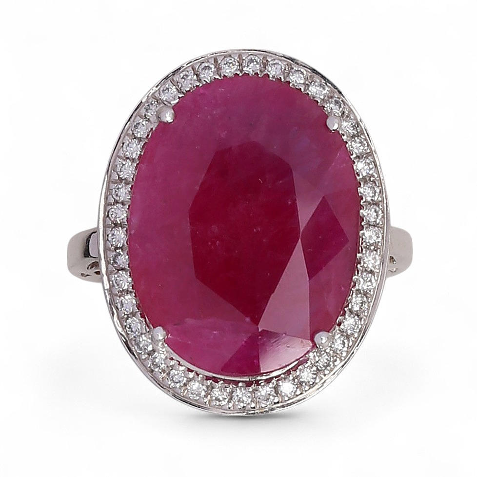 Ruby ring surrounded by diamonds.