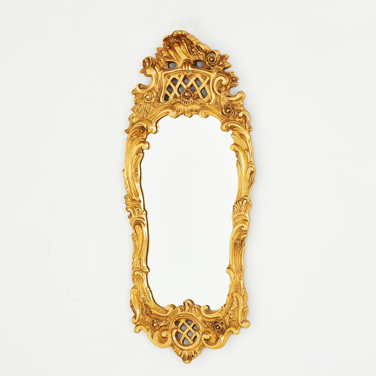 A mirror, Rococo style, 18th/20th century, gilded decor.
