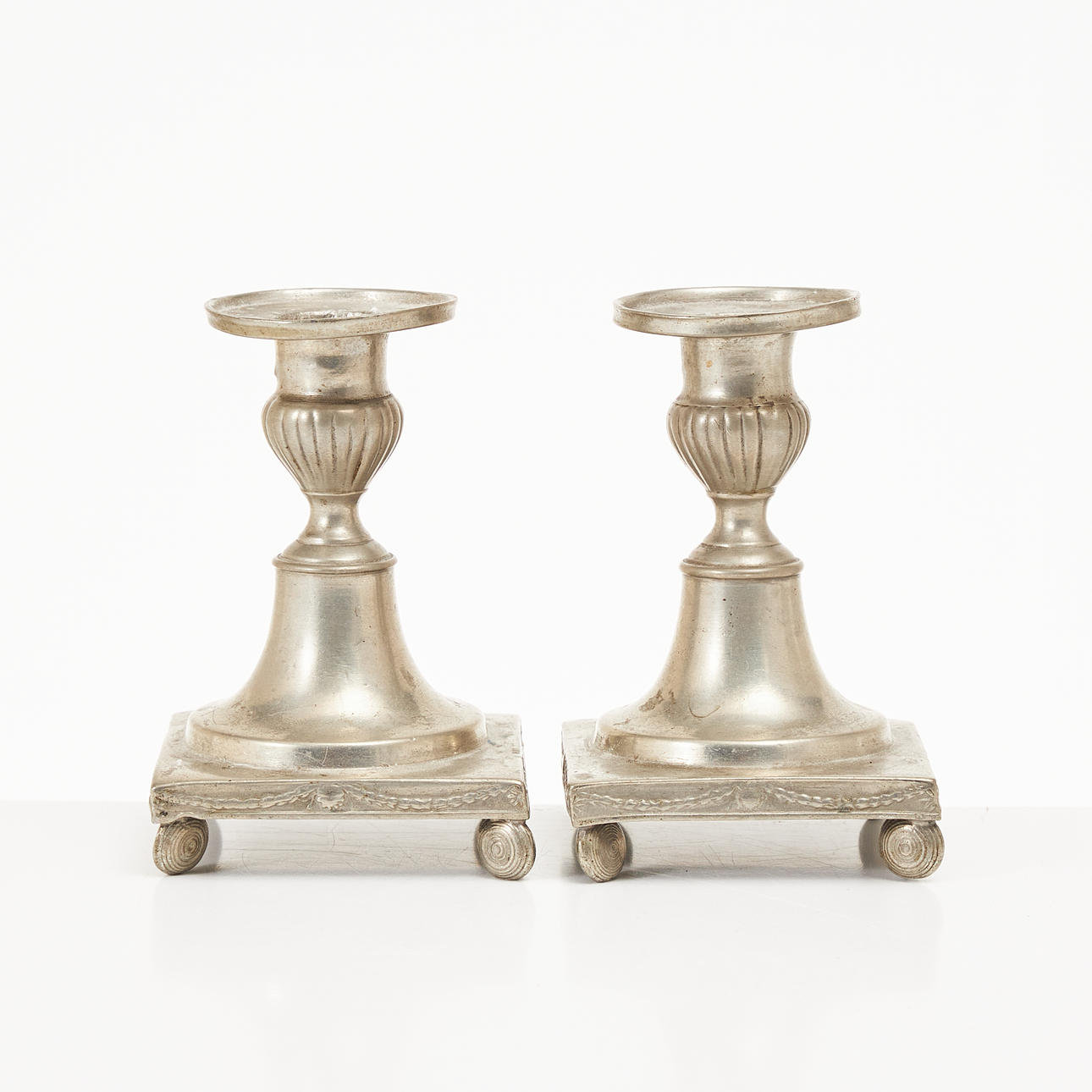A pair of tin candlesticks, Johan B. Sundberg (active 1781-1812), Gothenburg 1811.