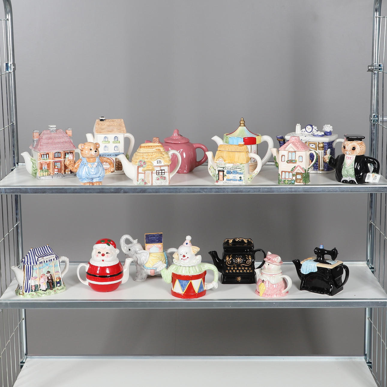 ASSORTED CERAMIC NOVELTY TEAPOTS.