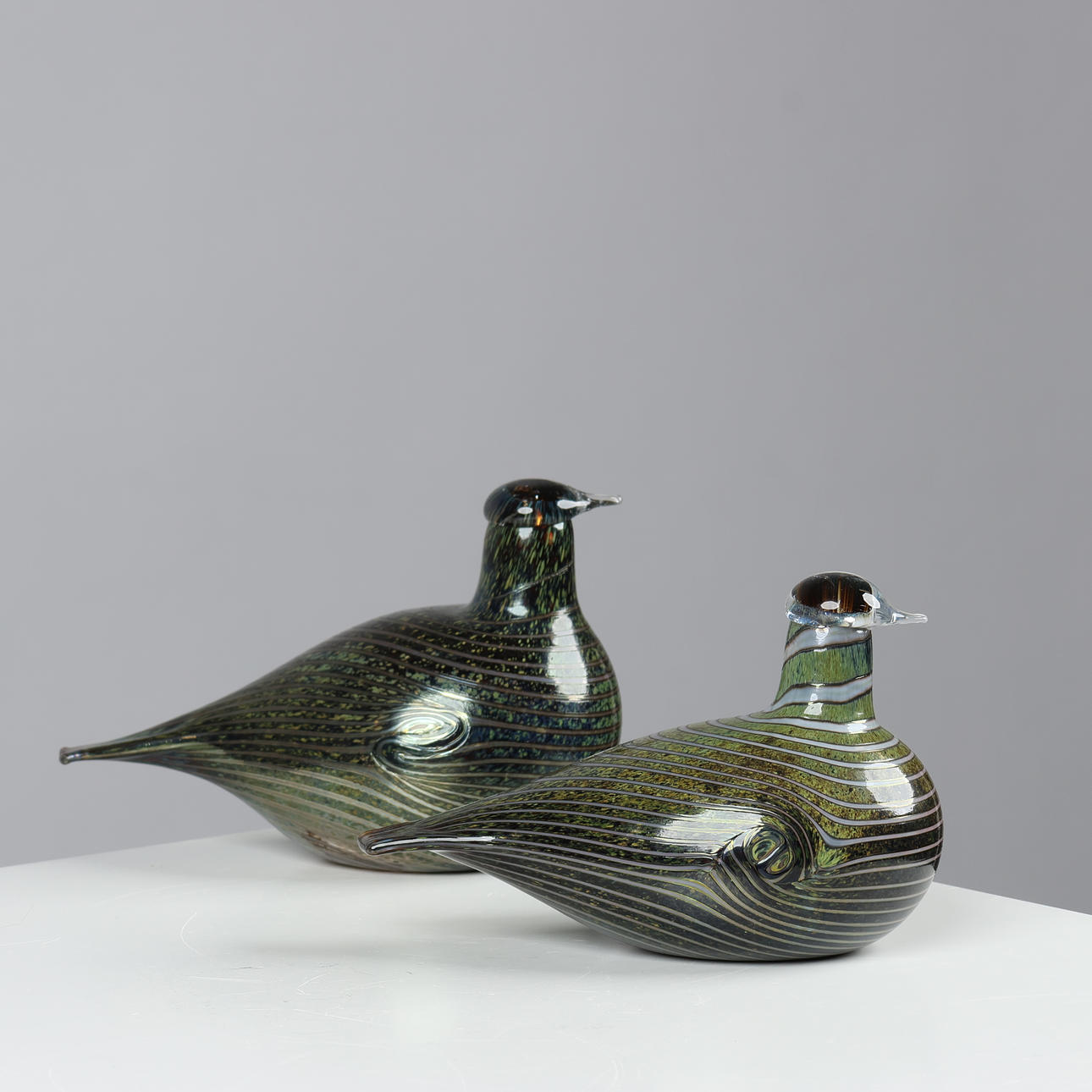 OIVA TOIKKA. A pair of handmade bird figurines in stained glass