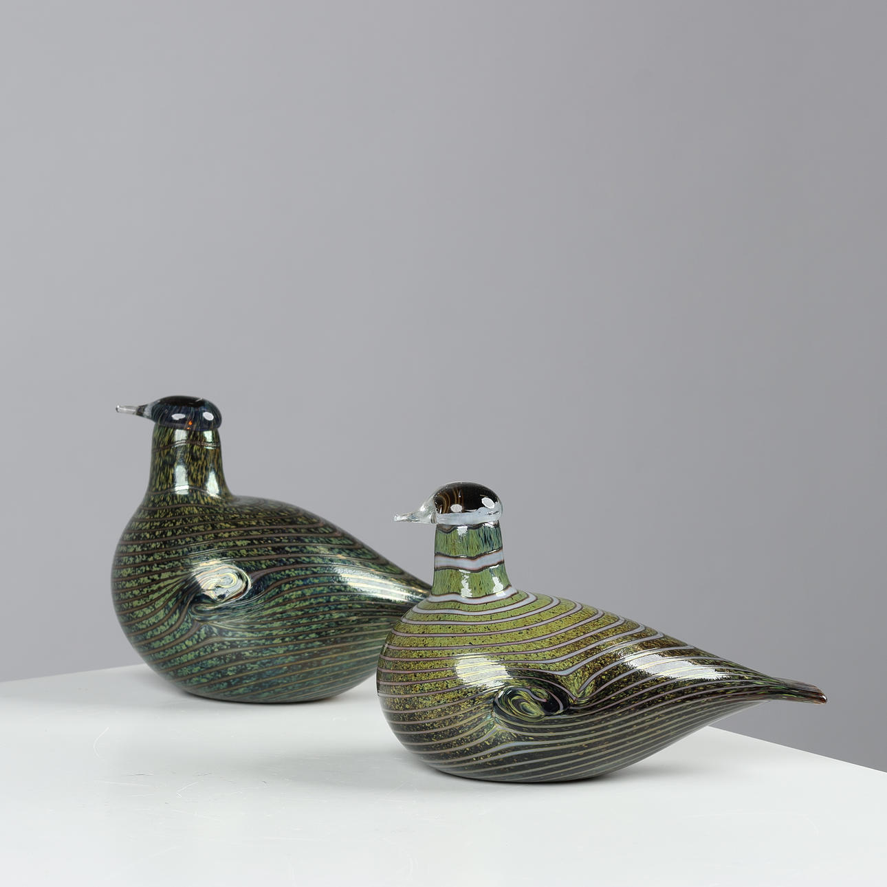 OIVA TOIKKA. A pair of handmade bird figurines in stained glass