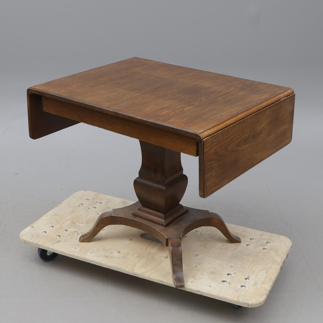 An oak folding table, early 20th century.
