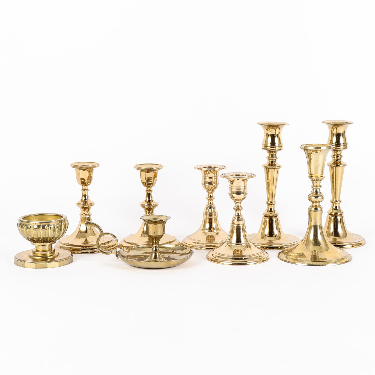 CANDLESTICKS 9 pieces, brass and ore.
