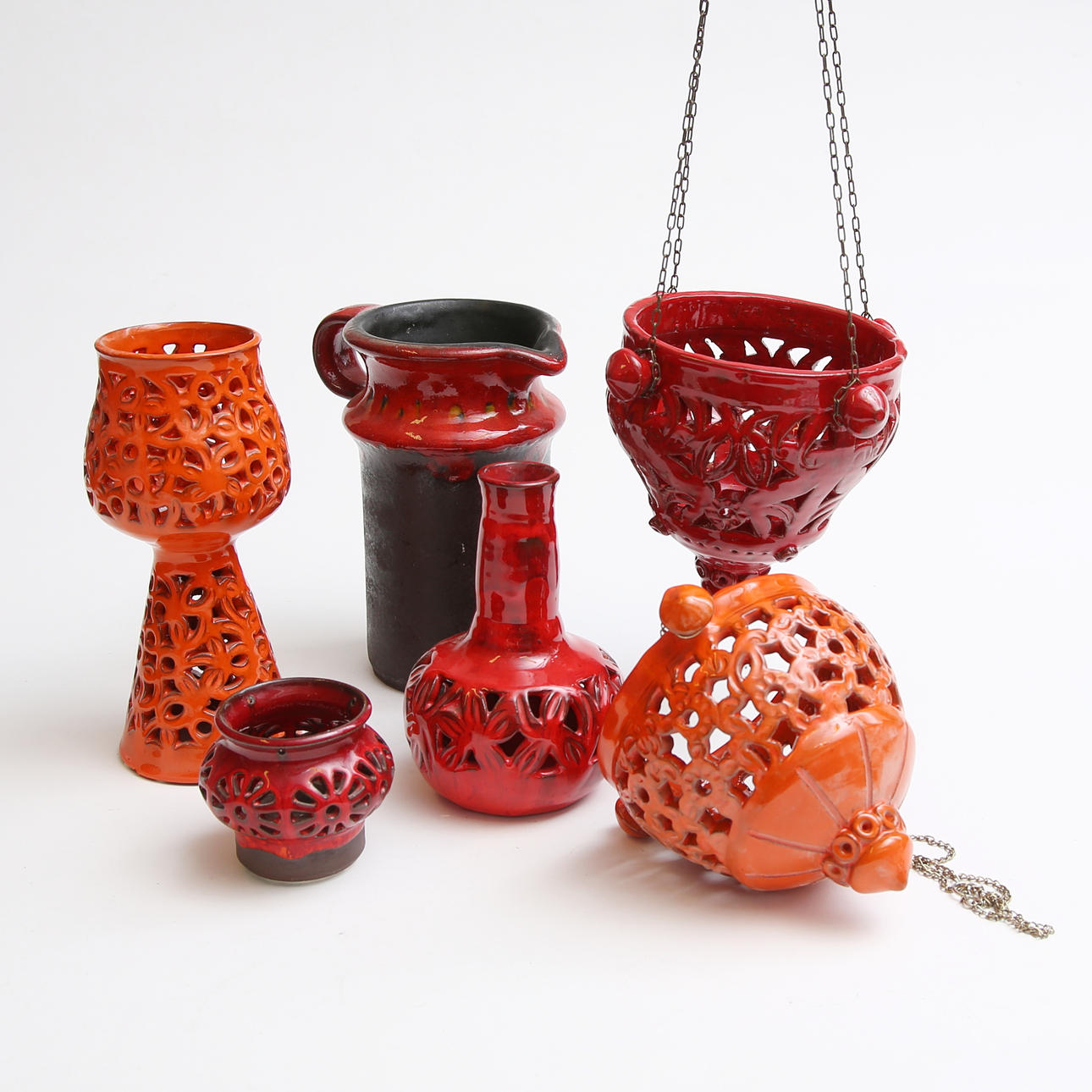 A set of 6 brown/orange ceramic objects, 1970s.