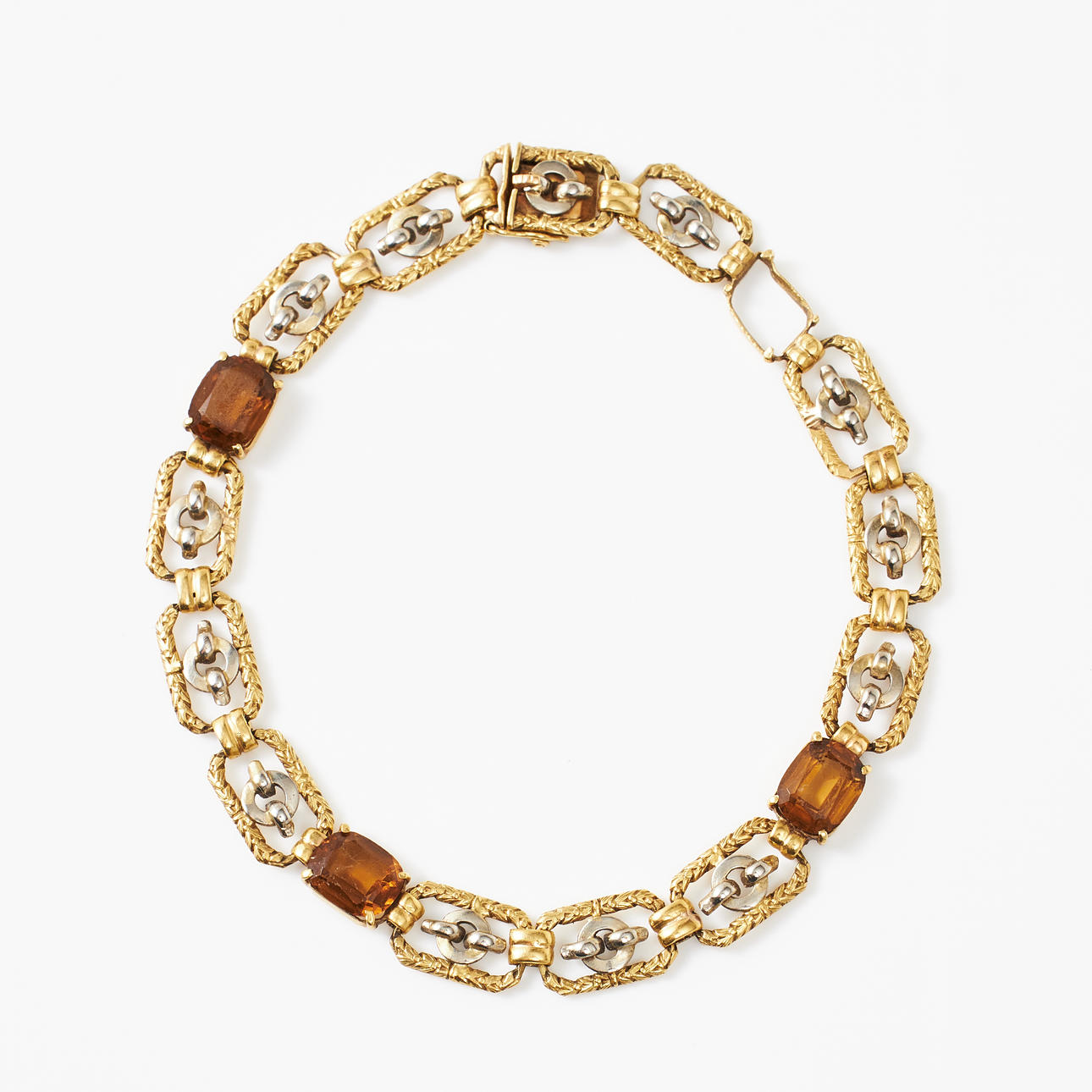 BRACELET, 18k red/white gold, rectangular decor pieces with intermediate orange-brown glass stones.