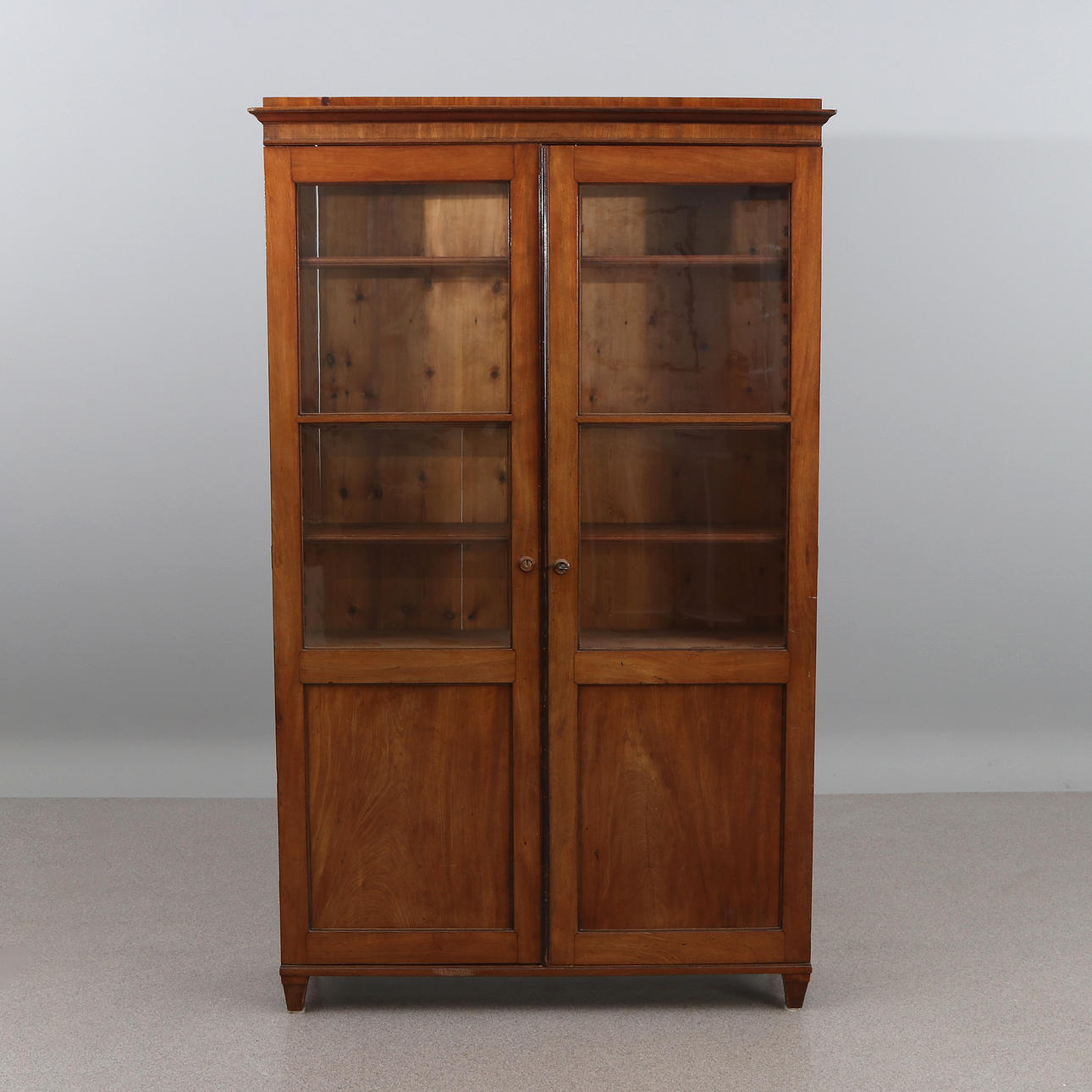BOOK CABINETS. Walnut. Around the year 1900.