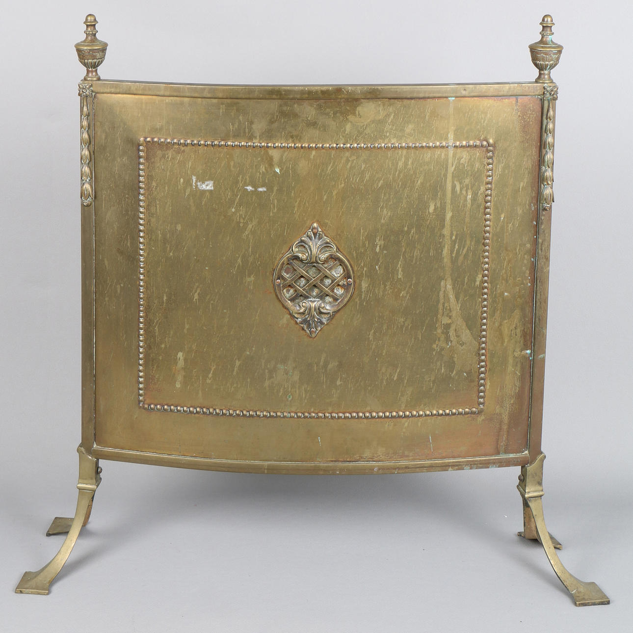 A 19TH CENTURY BRASS FIRE GUARD SCREEN.