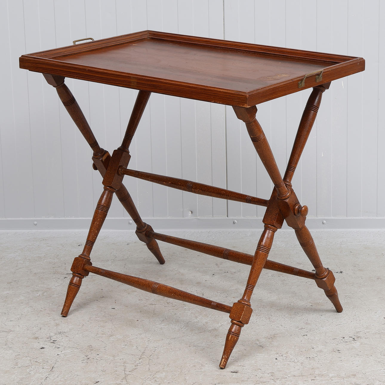 A folding tray table, early 20th century.