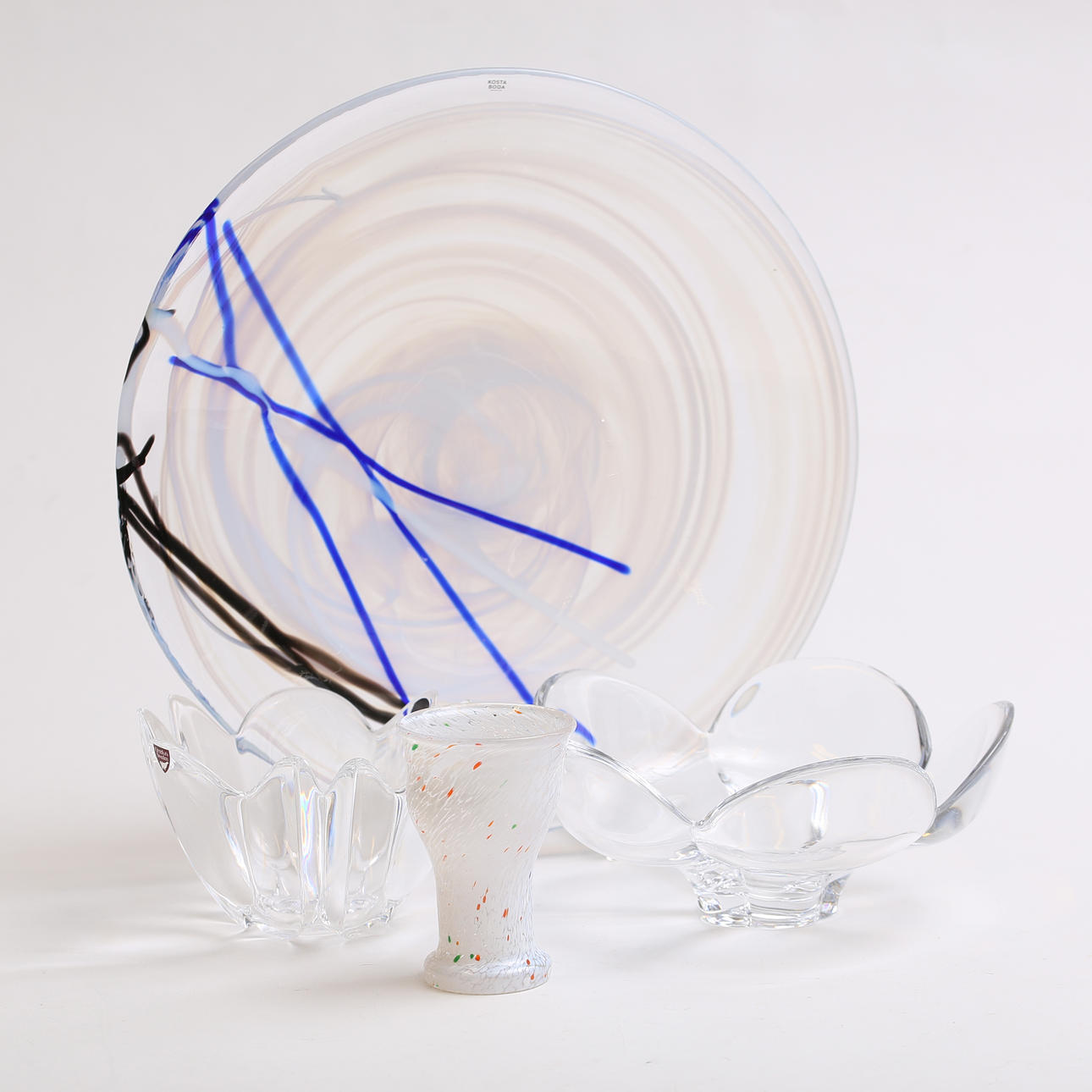 A set of 4 glass objects, including Kosta Boda.