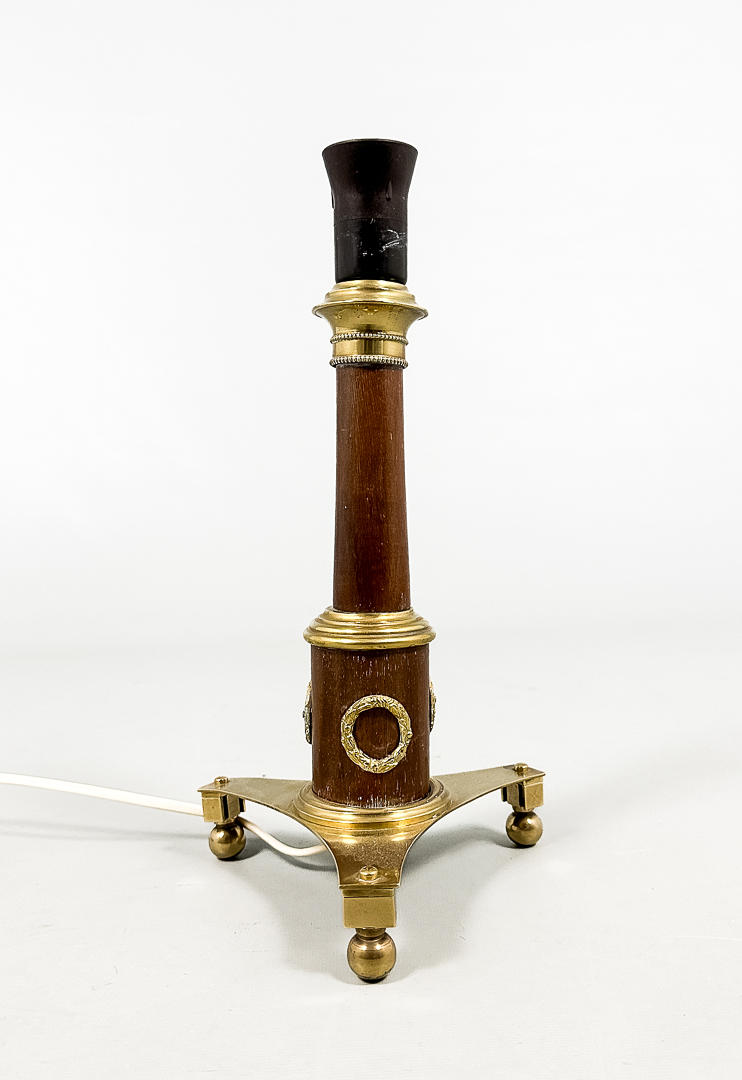 A table lamp, brass, wood, 20th century.