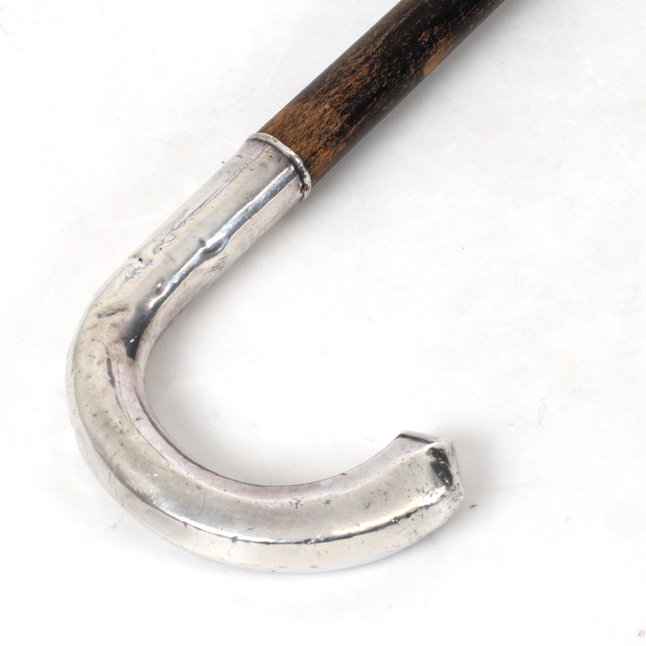 CANE WITH SILVER CRUTCH, CG Hallberg, 1934.