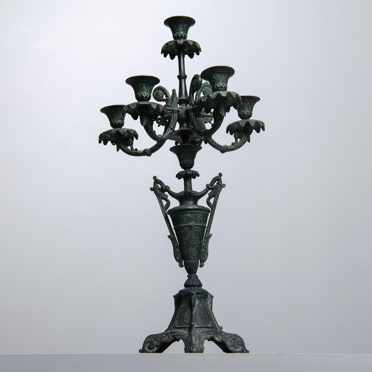 A cast iron candelabra, 20th century.