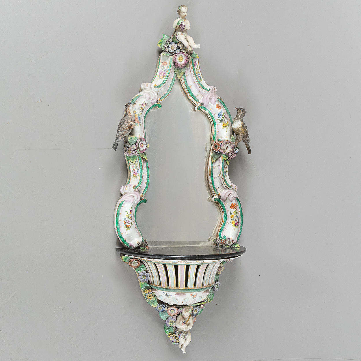 A wall console with a mirror, Rococo style, Meissen type, second half of the 19th century, probably Germany.