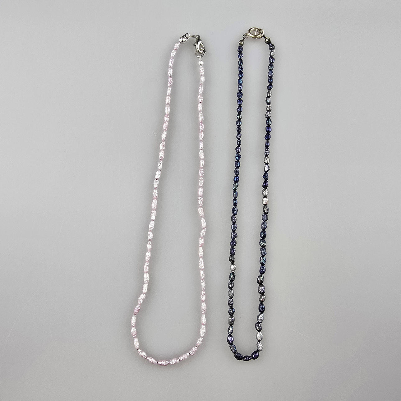 - TWO DELICATE PEARL NECKLACES.