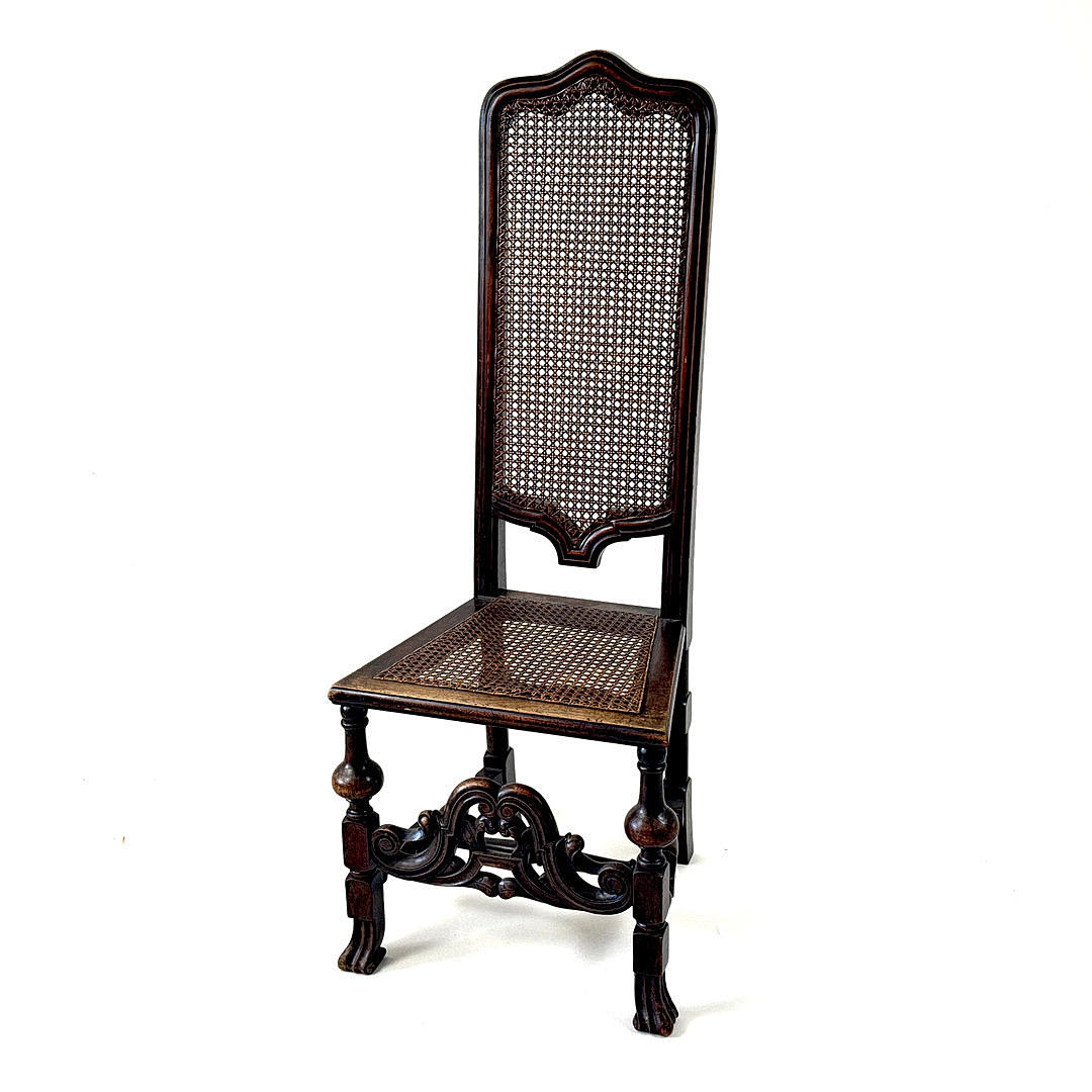 1920'S JACOBEAN STYLE CANE CHAIR.