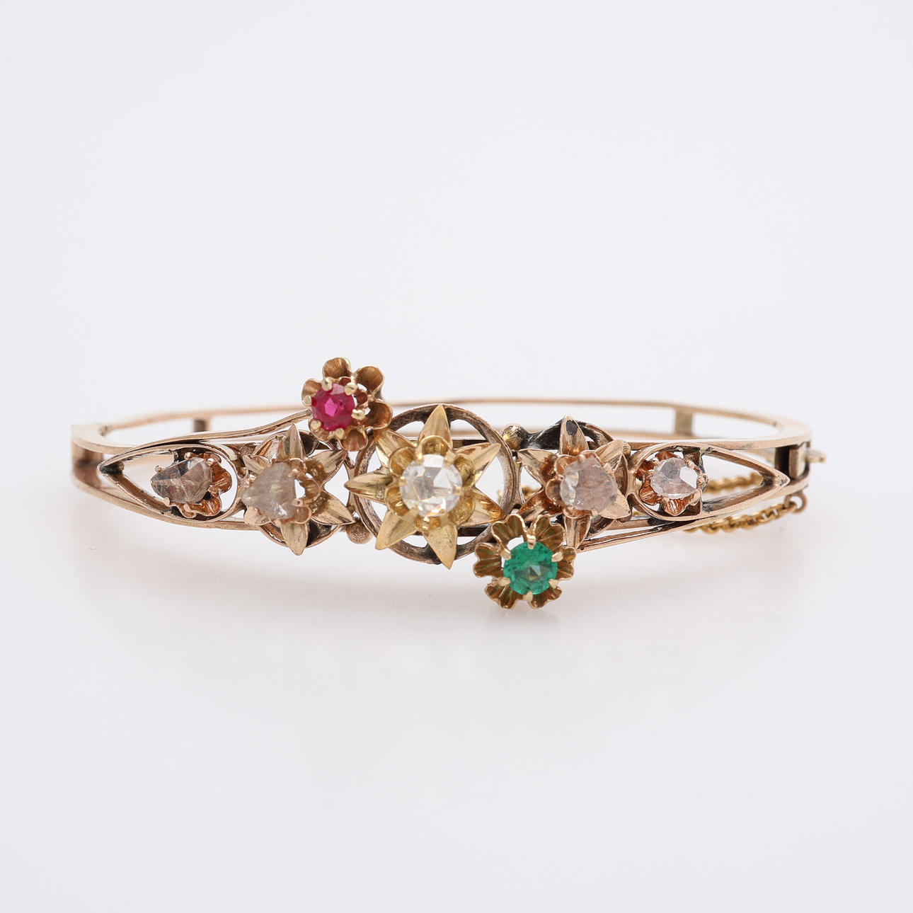 BANGLE 14K WITH ROSE STONE, DIAMONDS, SYNTHETIC RUBY AND GREEN STONE.