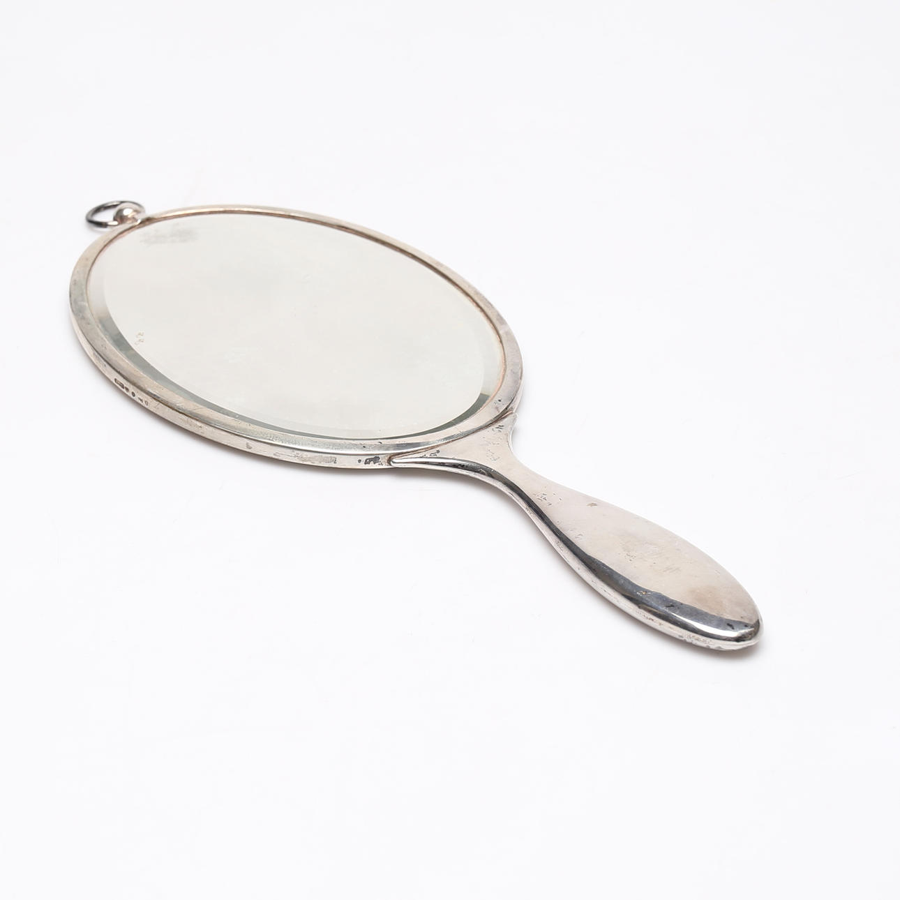 A silver hand mirror, early 20th century.