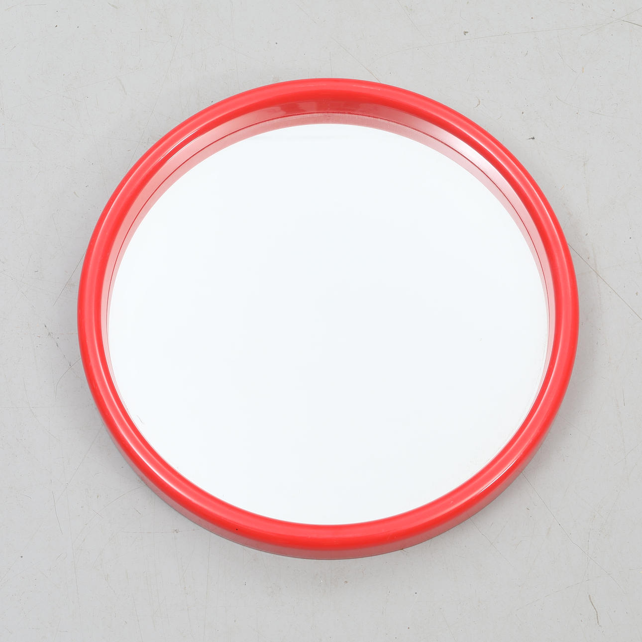 A plastic mirror, 1960s/70s.