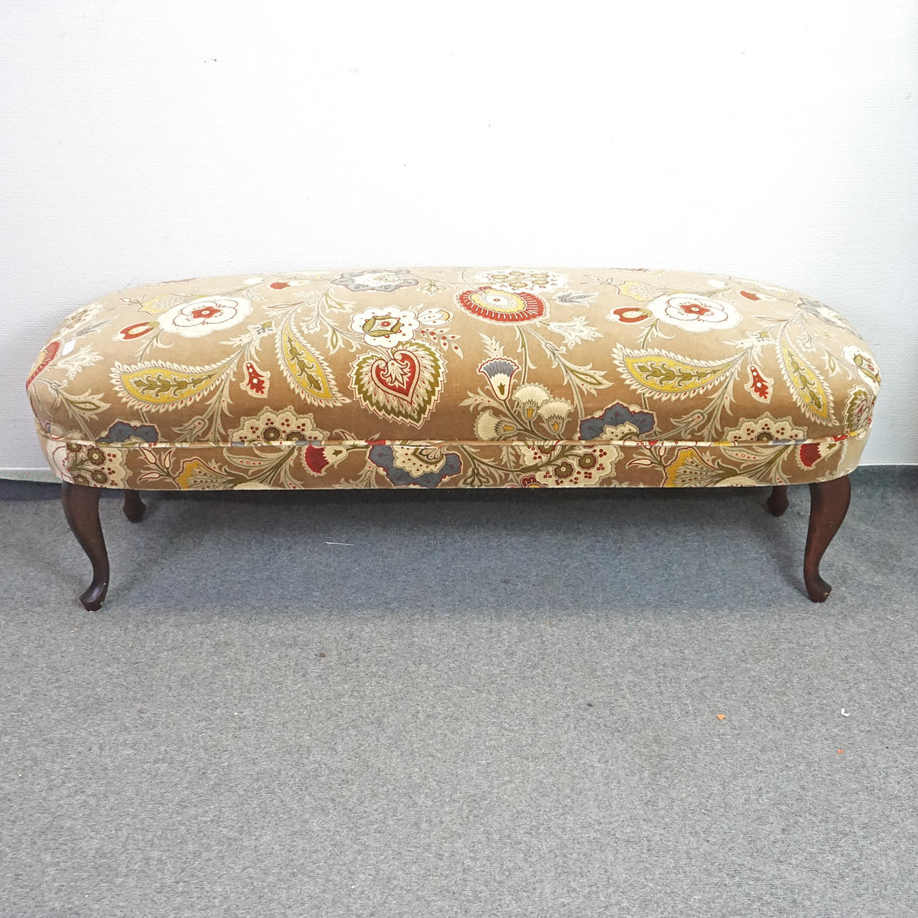 BENCH/PUFF, with patterned textile upholstery.