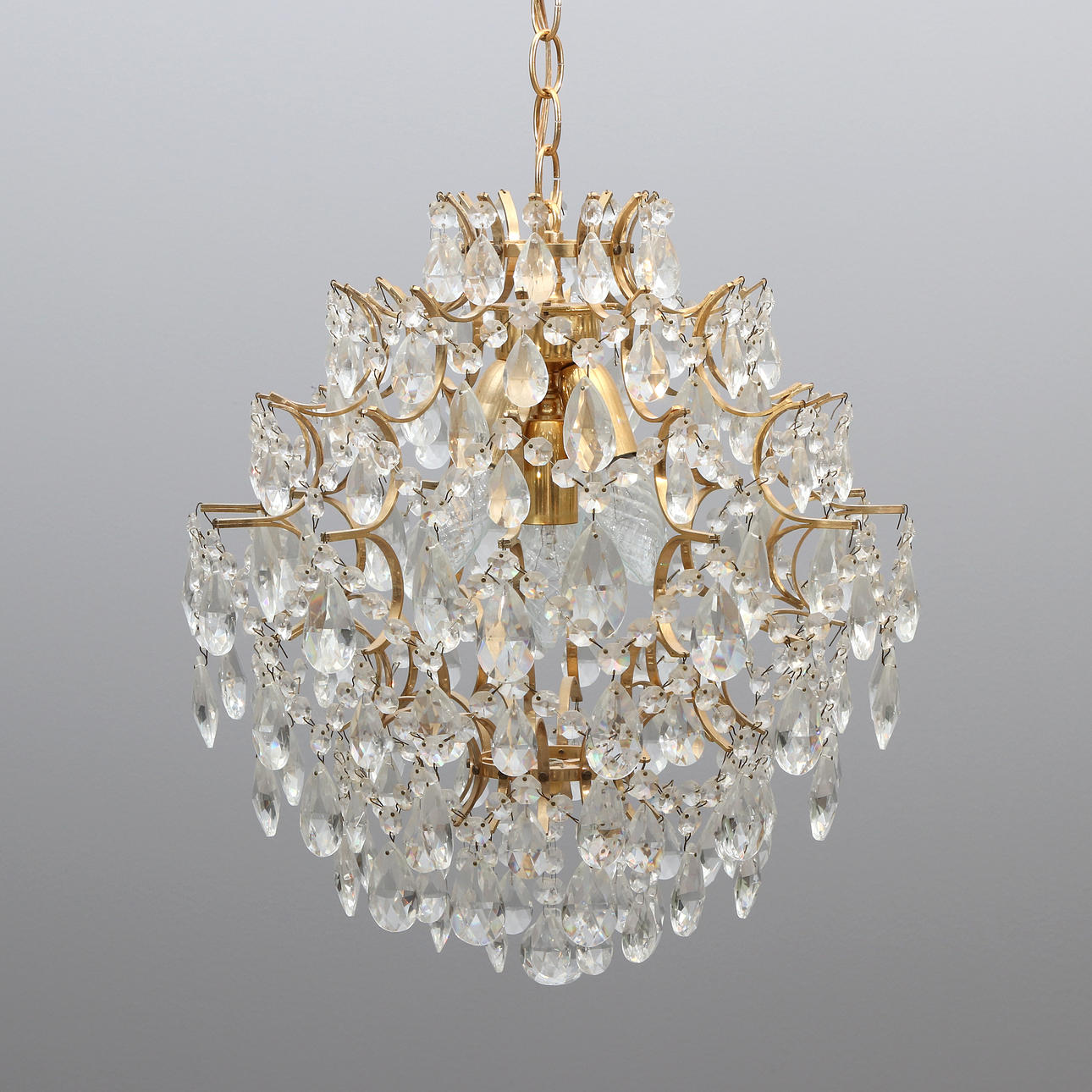 CEILING LUMINAIRE WITH PRISMS. Gilded brass frame with glass prisms. Second half of the 20th century.