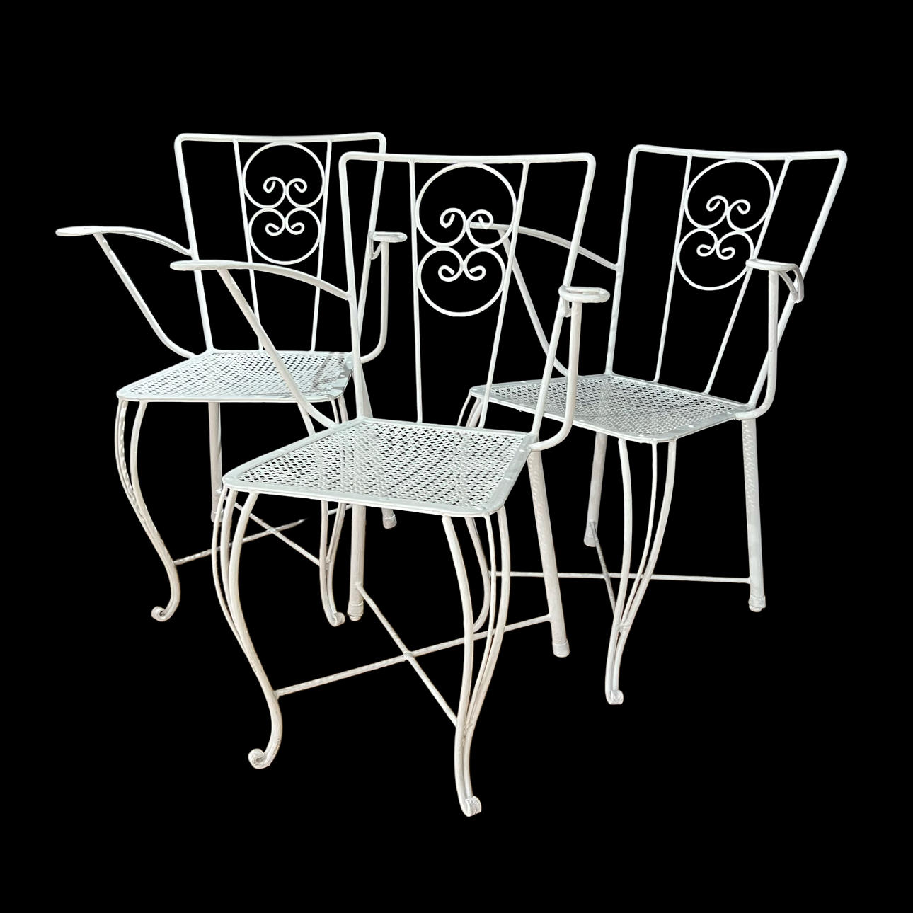 Three garden chairs in white iron.