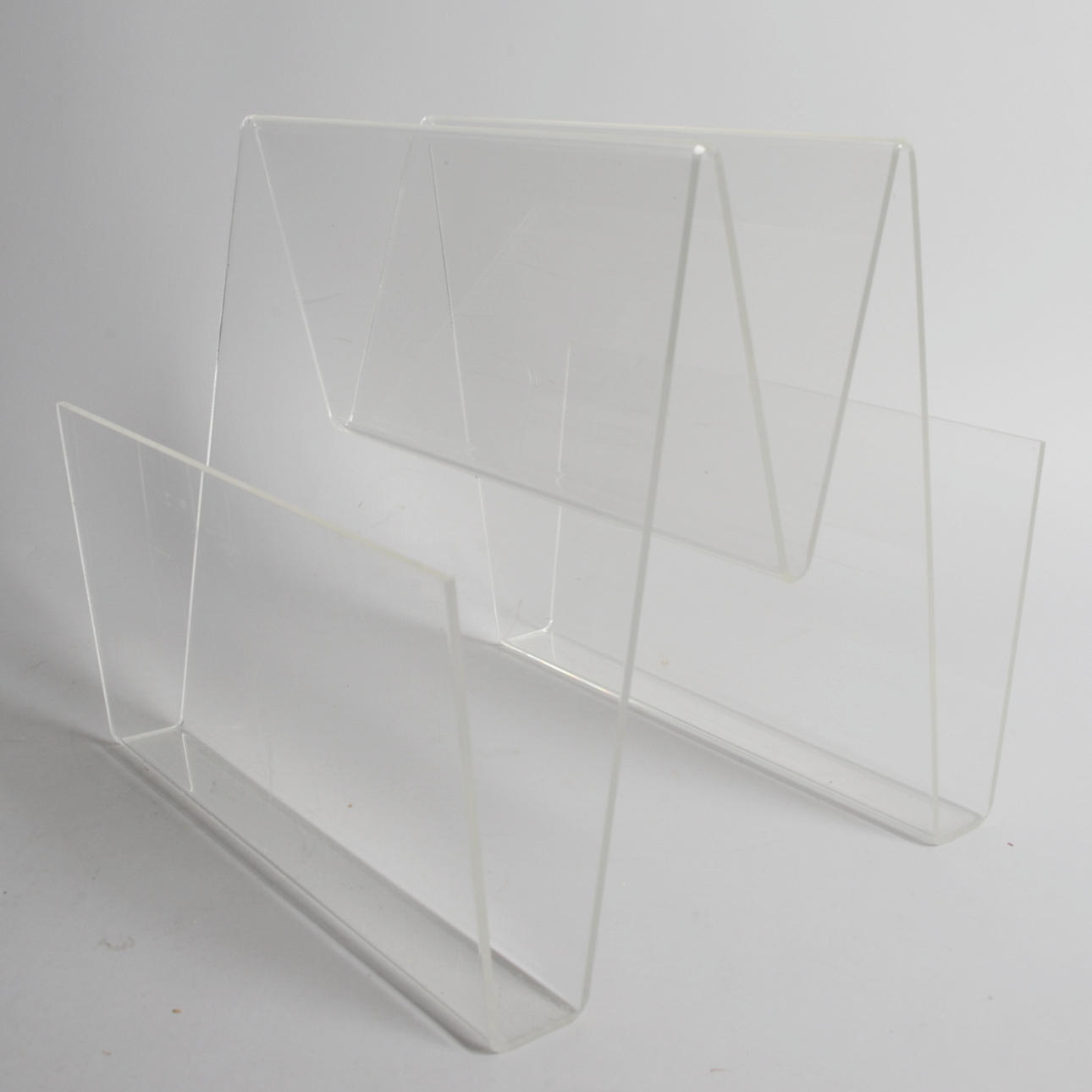 A 1970s Plexiglas Magazine Stand.