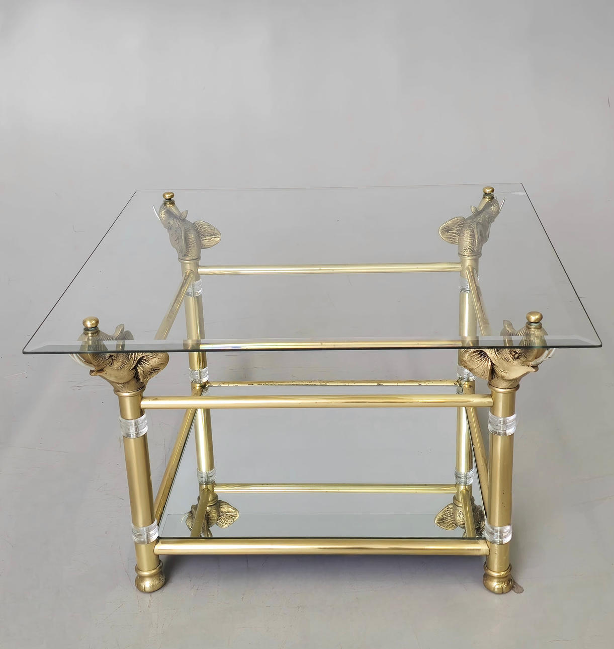 METAL TABLE WITH ELEPHANTS WITH GLASS TOP.