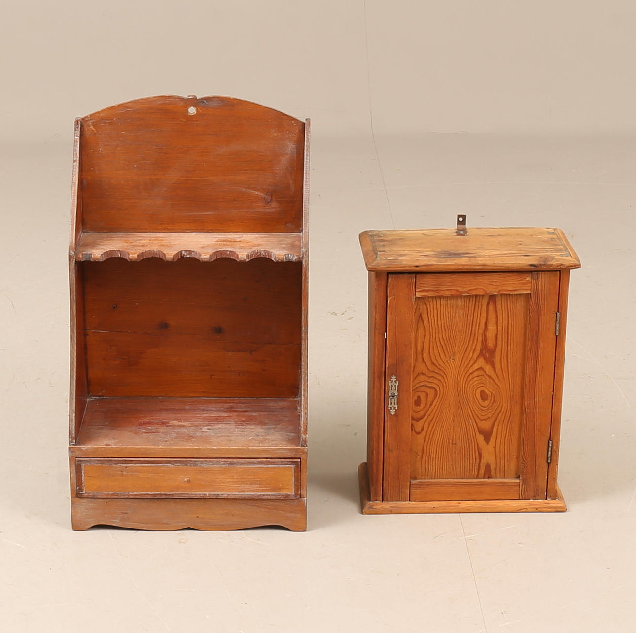 A pine hanging cabinet and pipe rack, first part of the 20th century.