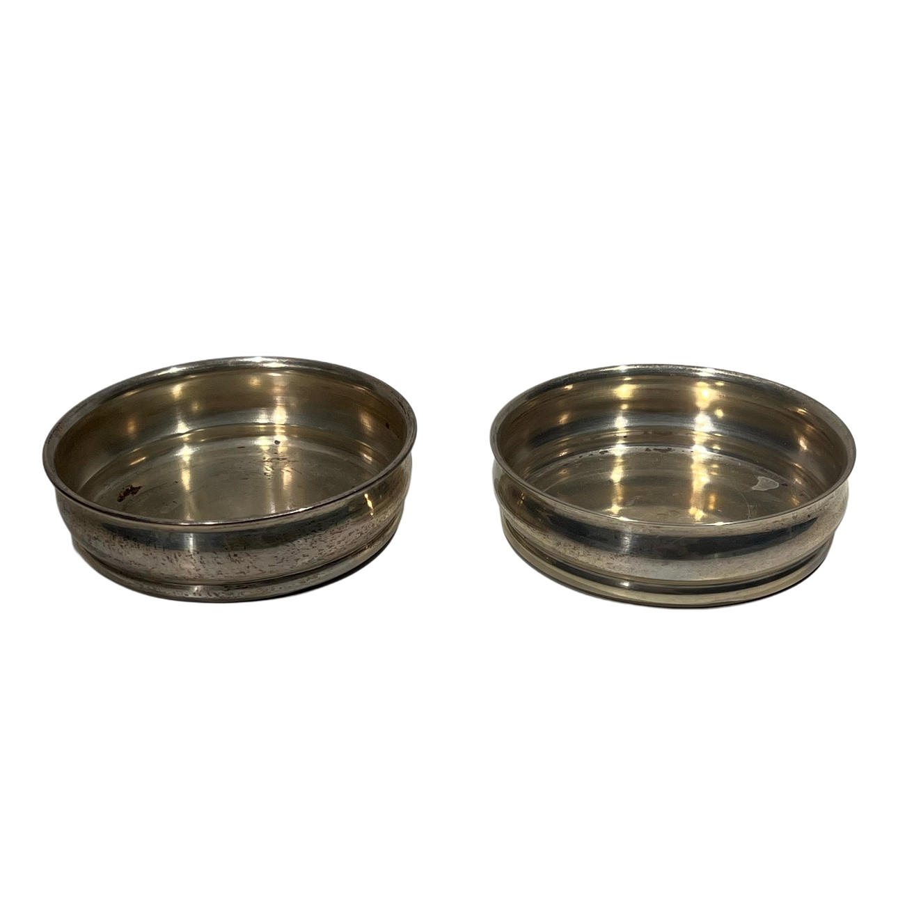 Couple holding bottles in punched silver.