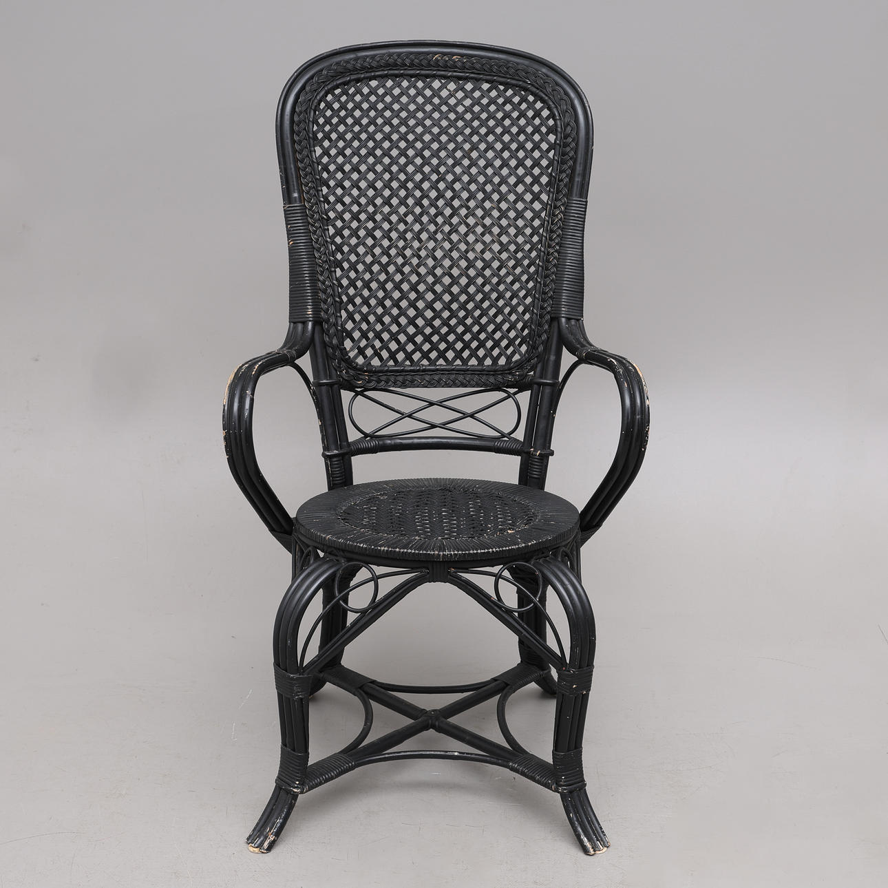 A mid 20th century wicker chair.