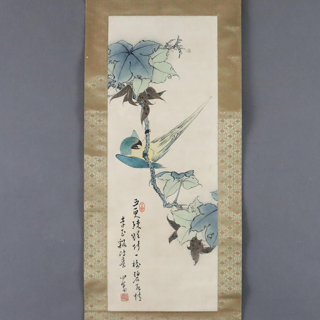 Chinese scroll painting - parrot on leafy branch, ink and colors on paper.