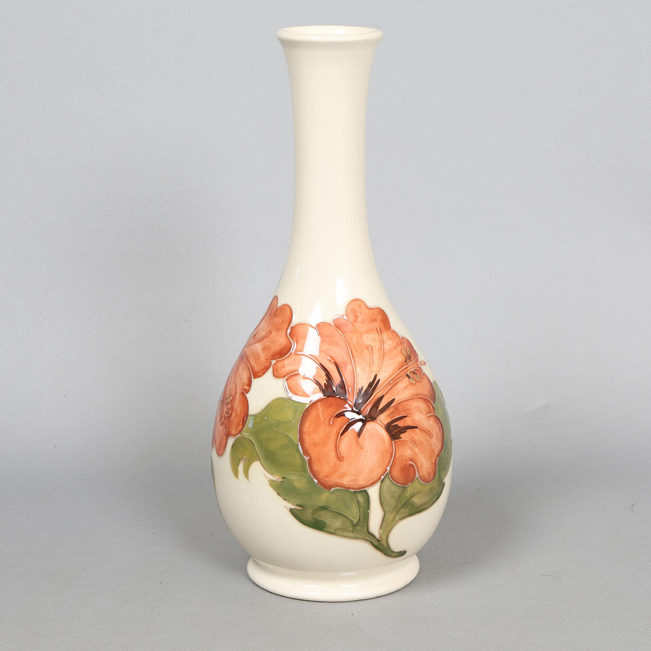 A MOORCROFT HIBISCUS PATTERN VASE.