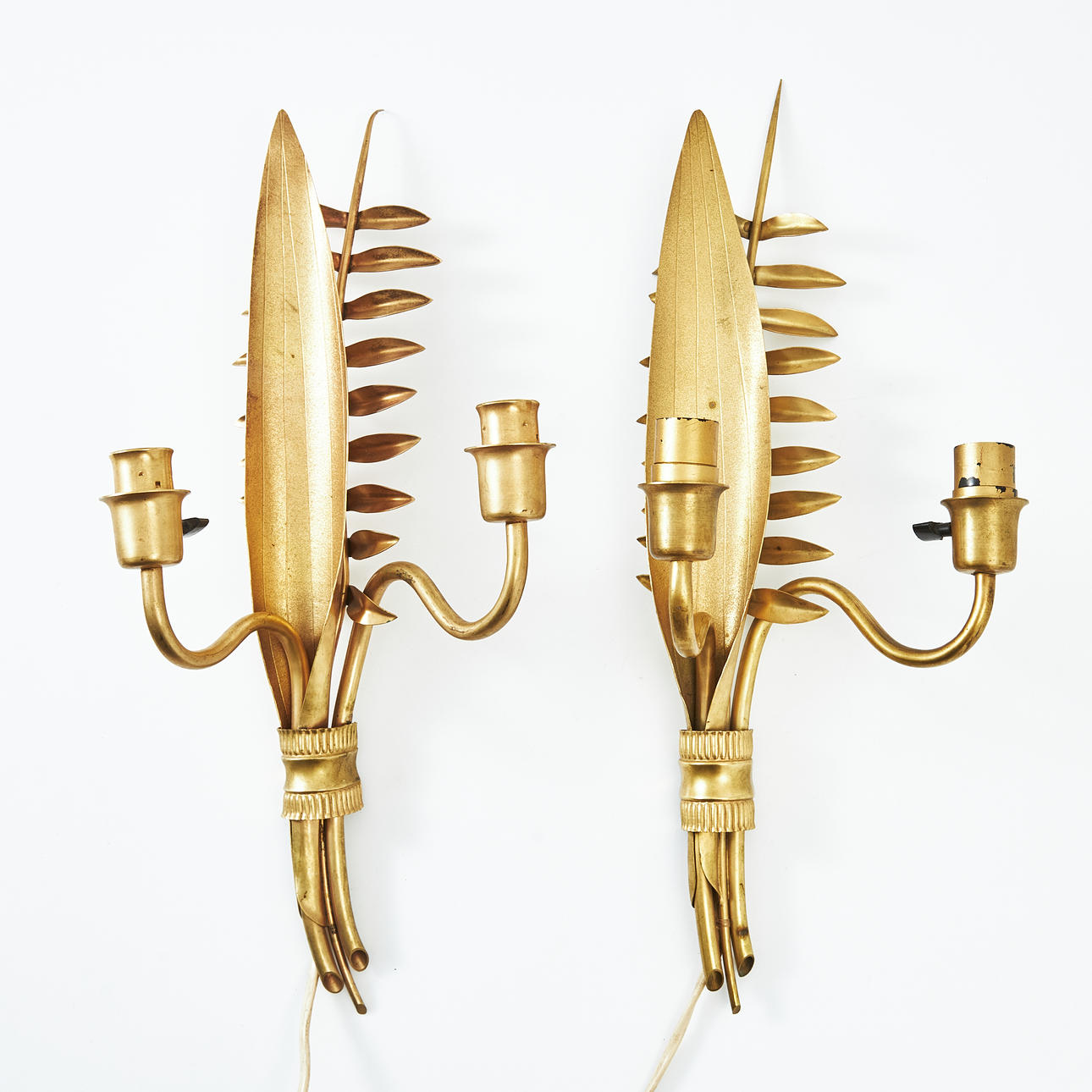 A pair of wall lamps, brass, in the form of vegetation, two light points each, 1940s.