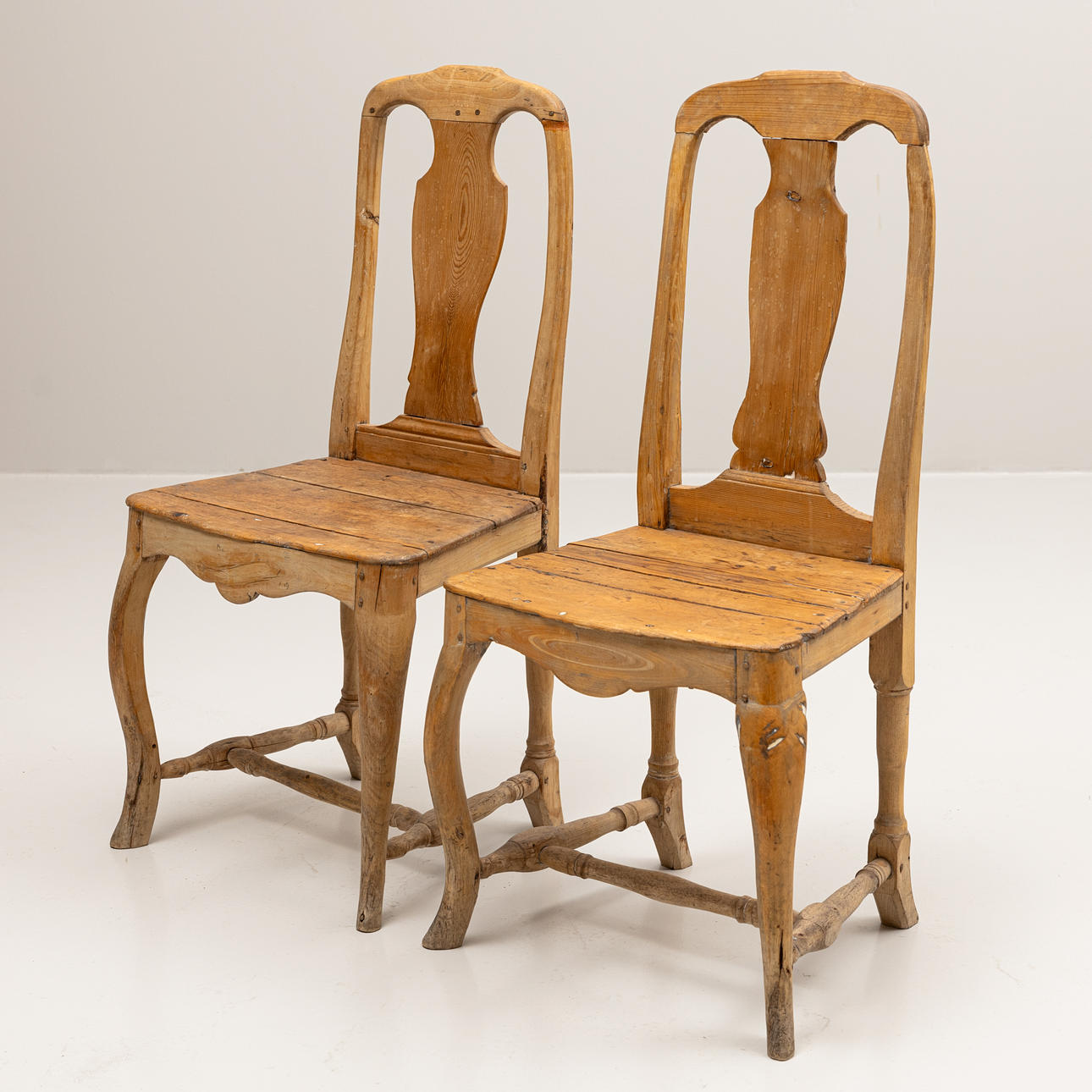 Two similar rococo chairs, mid 18th century.