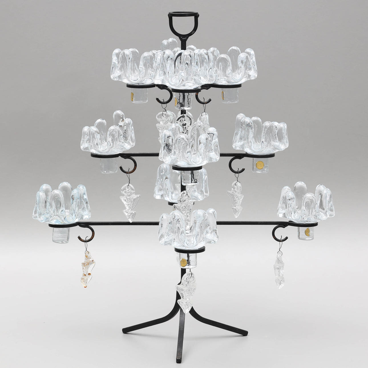 A 20th century glass and ironwork candlestick.