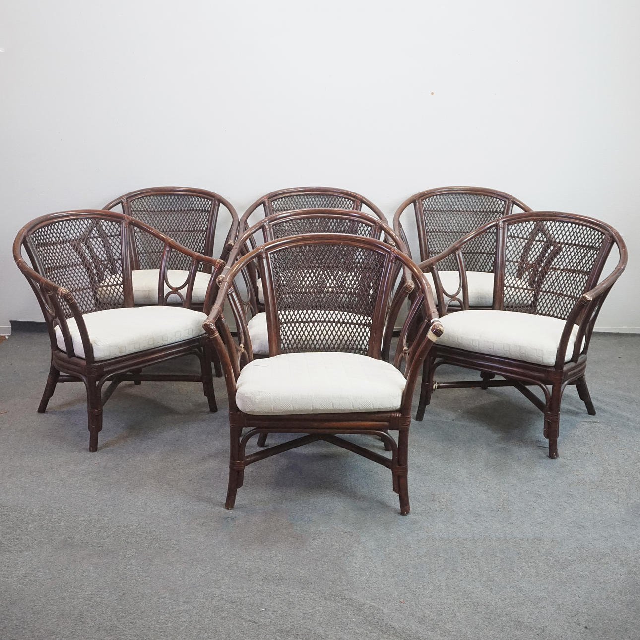 A set of 7 armchairs, rattan.