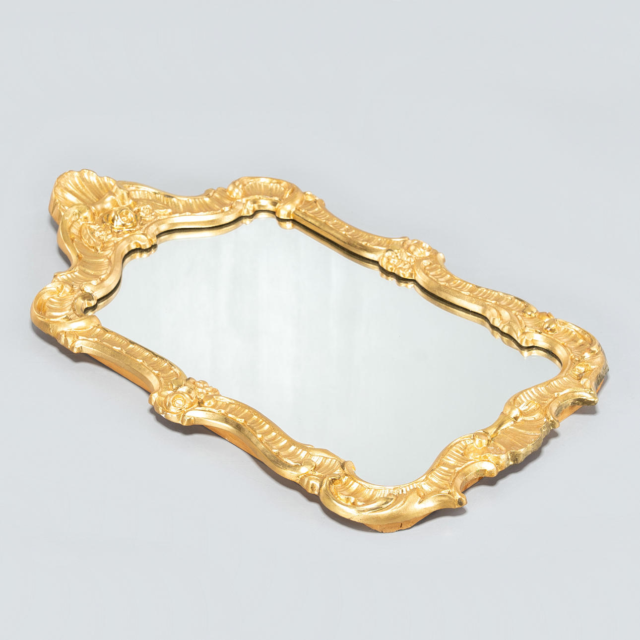 A 20th century rococo style mirror.